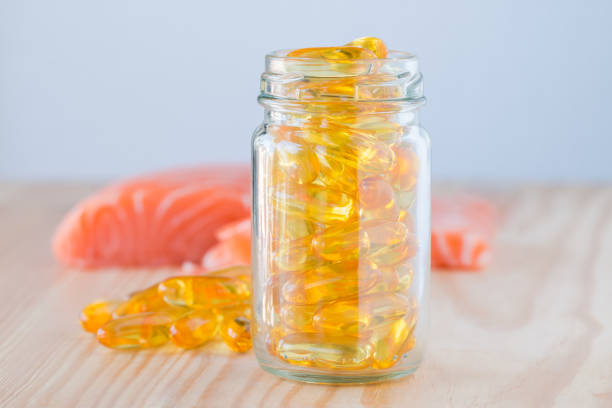 istock Pure omega salmon oil capsul and salmon. 842363532