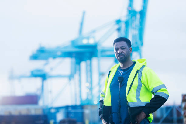 istock African-American man working at a shipping port 842363542
