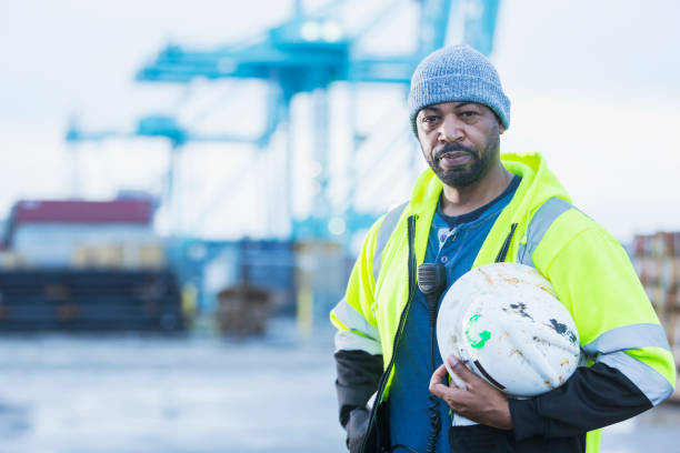 istock African-American man working at a shipping port 842363550