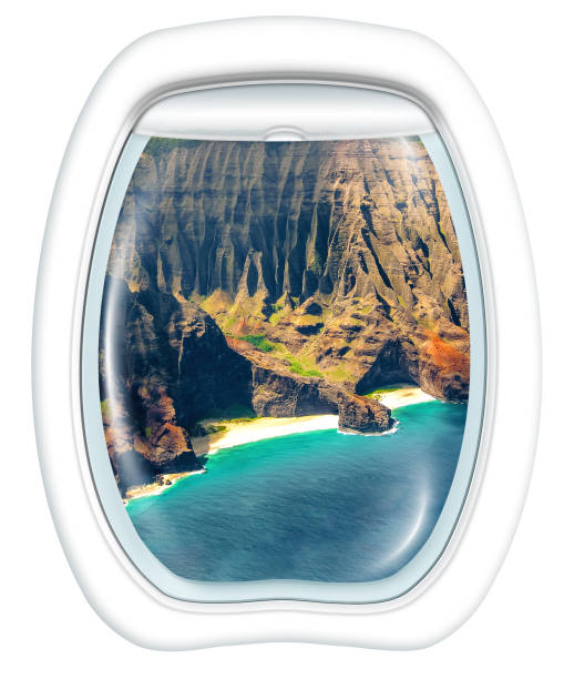 Plane window on Na Pali coast, Kauai, Hawaii, United States, from a plane through the porthole. Copy space.