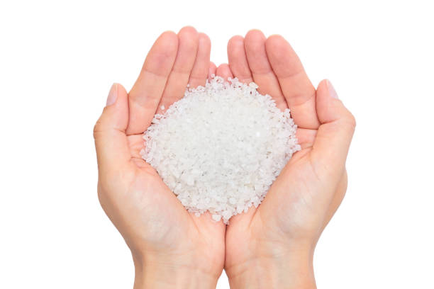 istock holding sea salt isolated on white background 842369632