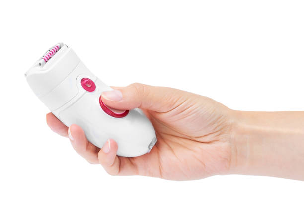 istock Female hand with modern epilator isolated on white background 842369662