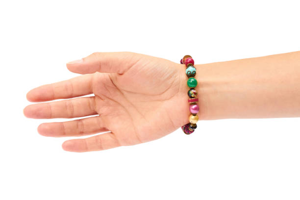 istock Female hand with bracelets isolated on white bakground 842369732