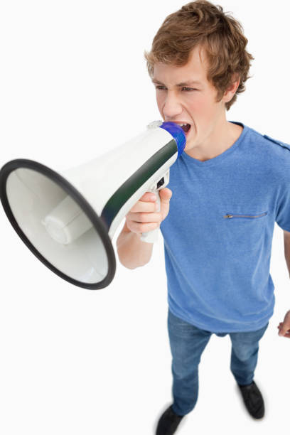 istock Fisheye view of a male student using a loudspeaker 842373718