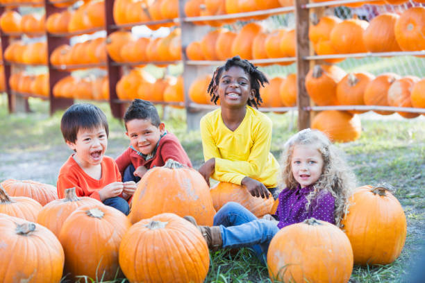istock Multi-ethnic children at pumpkin stand 842374014