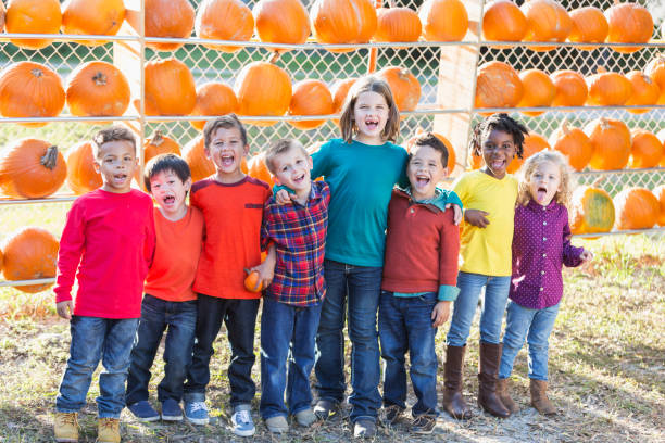 istock Multi-ethnic group of children at pumpkin stand 842374052