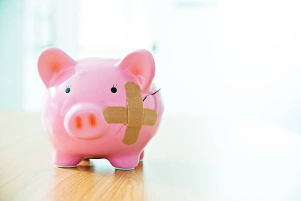 istock Broken piggy bank with band aids 842379306