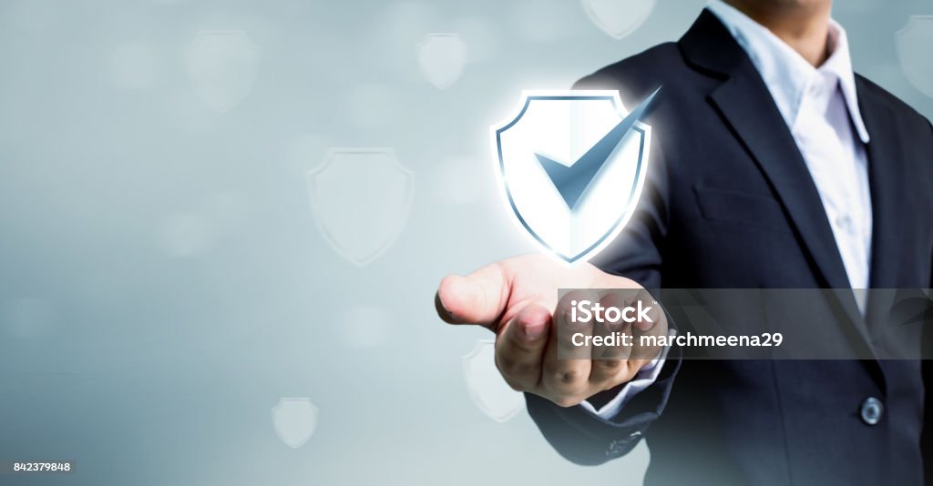 Businessman holding shield protect icon, Concept cyber security safe your data Security Stock Photo
