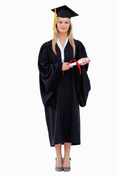 istock Blonde student in graduate robe holding her diploma 842383588