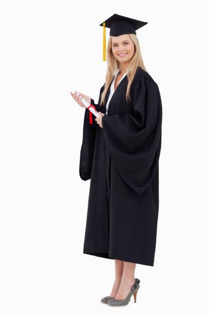 istock Blonde student in graduate robe holding a diploma 842383594