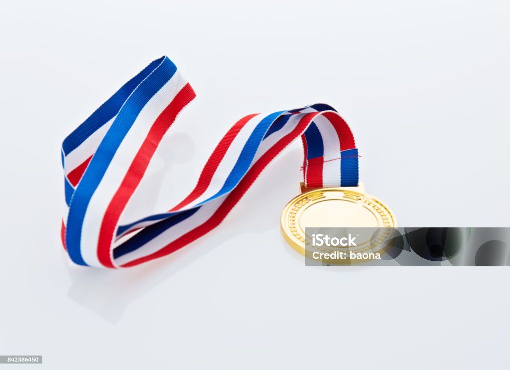 Single gold medal isolated on white background Single gold medal isolated on white background. Gold Medal Stock Photo