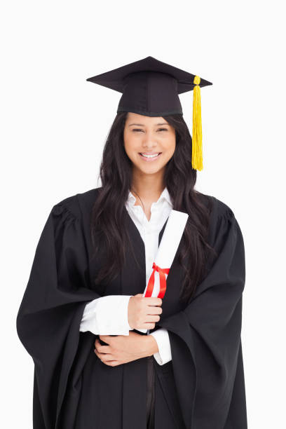 istock Woman with her degree dressed in her graduation gown 842390140