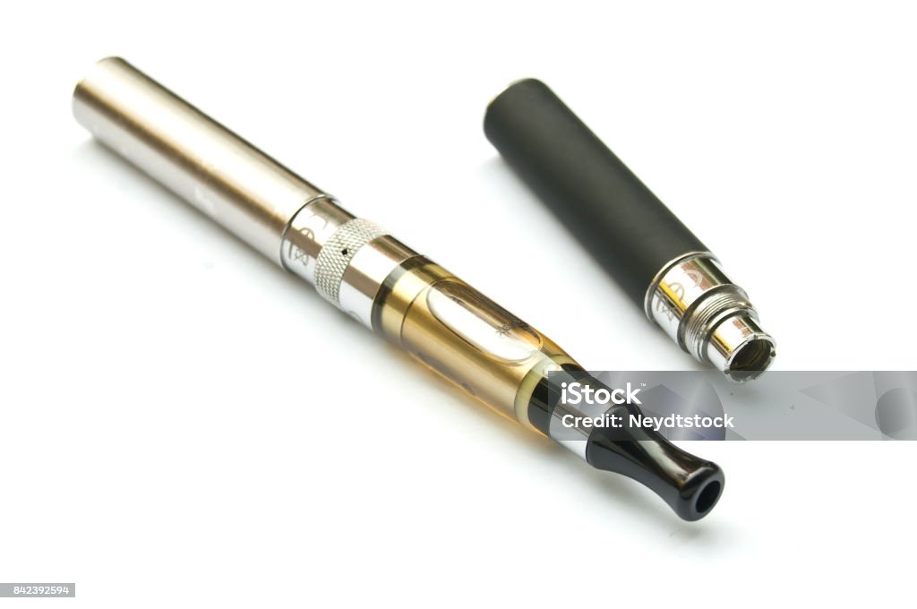 E-cigarette closeup with second battery on white background Addiction Stock Photo