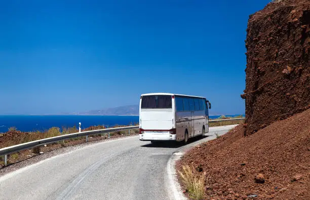 Photo of Greece Santorini the rise of bus on winding road