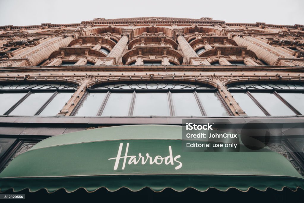 harrods knightsbridge Kensington, London: Harrods shopping centre storefront as seen from Brompton road in Kensington, London Harrods Stock Photo