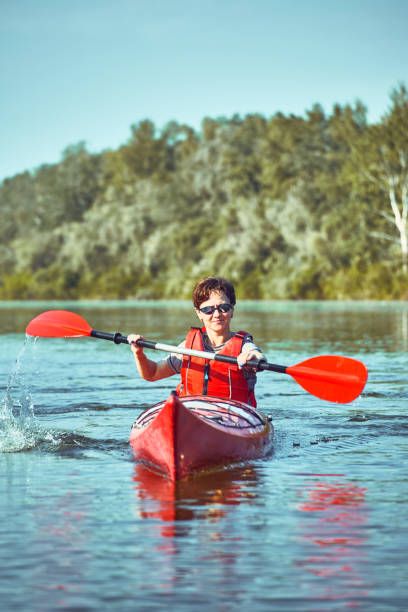 istock A canoe trip along the river along the forest in summer. 842425116