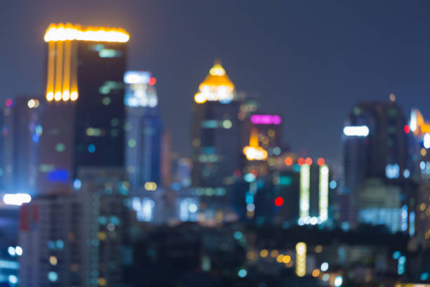 istock Night blurred bokeh light city office building downtown 842428864