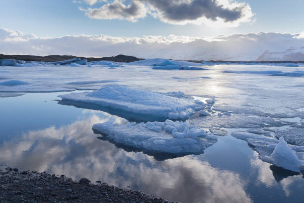 istock Winter season lake with reflection sky 842430328