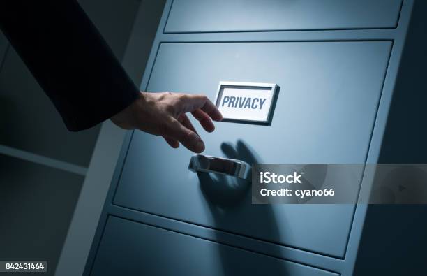 Office Worker Searching Confidential Information Stock Photo - Download Image Now - Privacy, File Folder, Manager