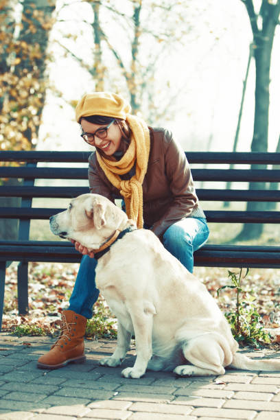 istock Woman and dog enjoying fall 842432746