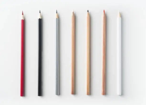 Top view of collection of pens on white background desk for mockup