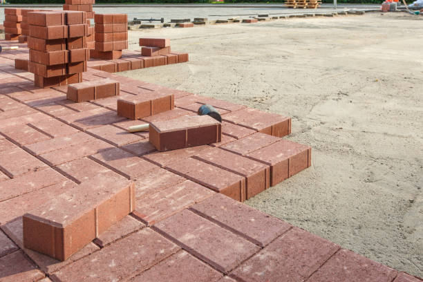 istock Installation  paving stones with a huge rubber hammer 842438386