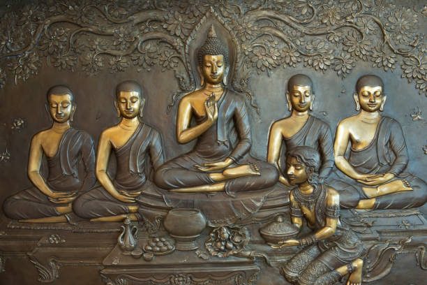 istock Buddha statue on temple wall in Thailand. 842439594