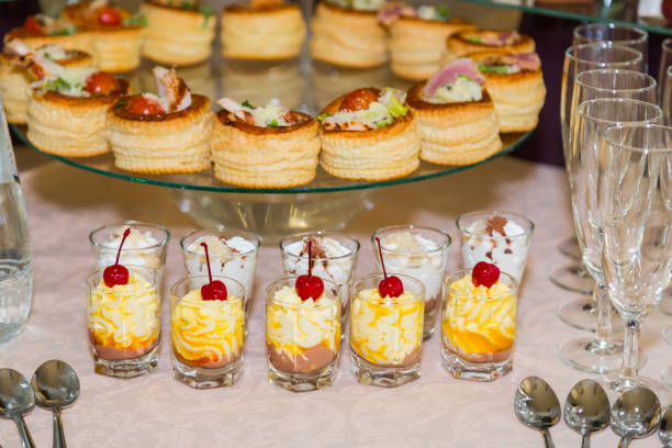 istock Snacks, fish and meat specialities on the buffet. Desserts. A gala reception. Served tables. Catering 842441508