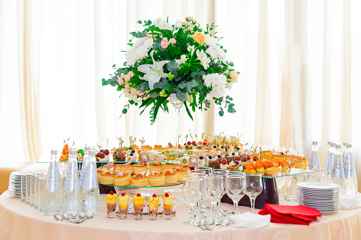 Snacks, fish and meat specialities on the buffet. Desserts. A gala reception. Served tables. Catering.