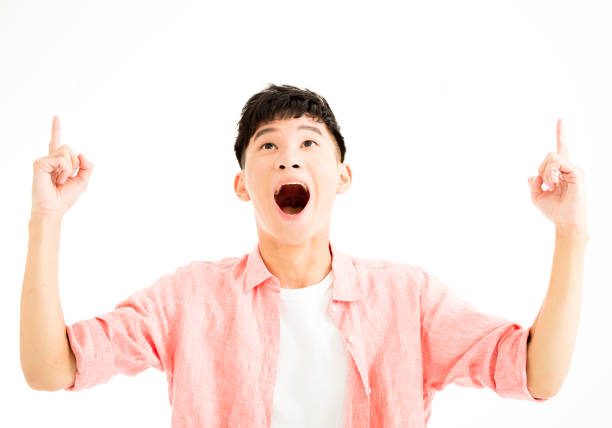 portrait of surprised young man looking up