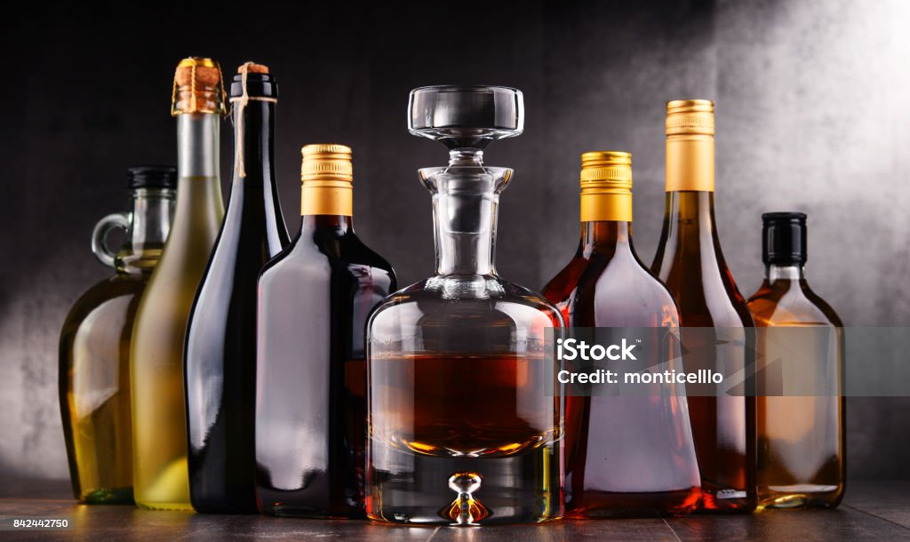 Bottles of assorted alcoholic beverages Composition with bottles of assorted alcoholic beverages. Alcohol - Drink Stock Photo