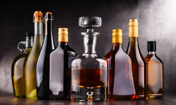Bottles of assorted alcoholic beverages Composition with bottles of assorted alcoholic beverages. distillation photos stock pictures, royalty-free photos & images