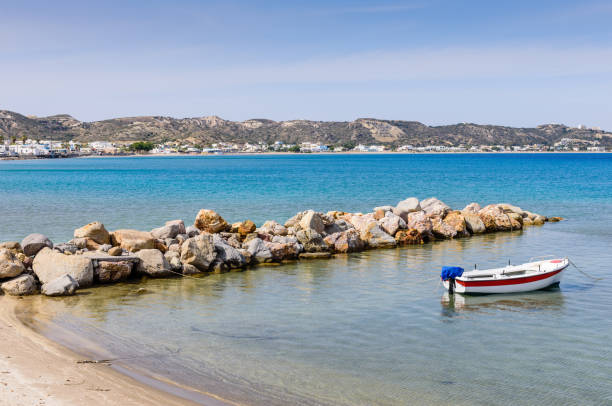 Beautiful sandy beach with fishing boat