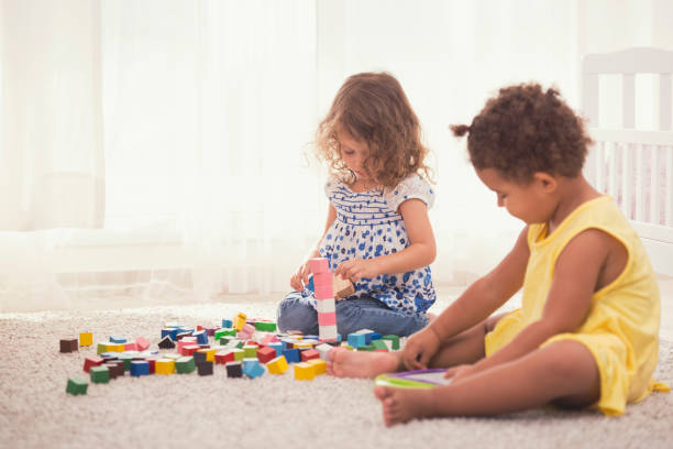 istock Adorable busy girls playing together. 842443974