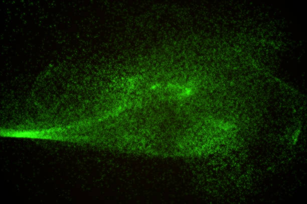 istock Abstract background made of green glowing particles 842447284