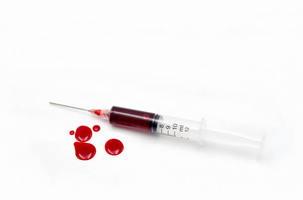 Syringe with blood stock photo
