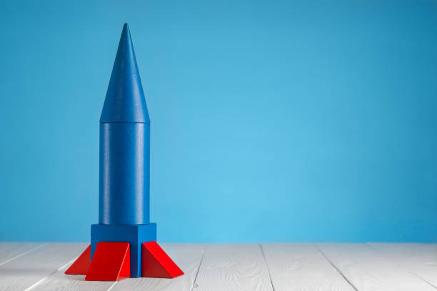istock Abstract blue rocket from wooden blocks with copy space. 842447916