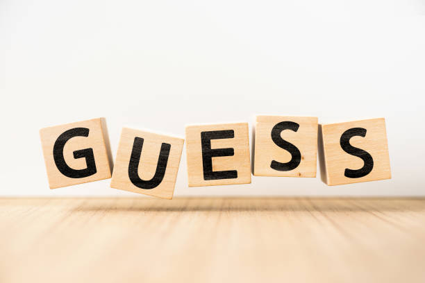 Surreal abstract geometric floating wooden cube with word GUESS concept