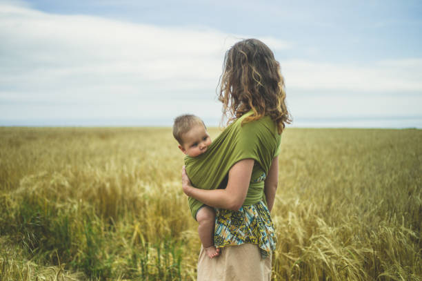 istock Mother with baby in field 842448426