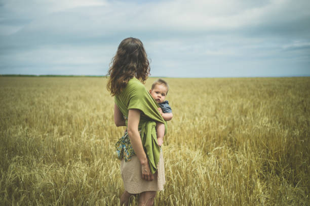 istock Mother with baby in field 842448484