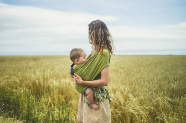 istock Mother with baby in field 842448526