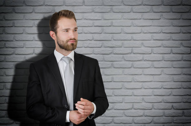 istock Handsome businessman in suit copy space 842451878