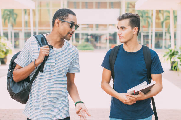 istock Cool guy telling story to friend during stroll 842454766