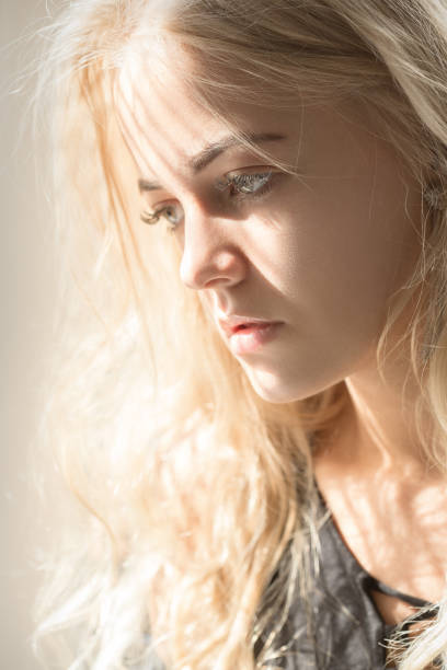 istock blond female portrait 842454998