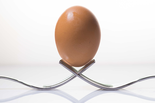 Egg in balance with space for place your logo