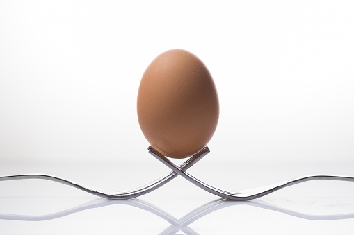 Egg in balance with space for place your logo