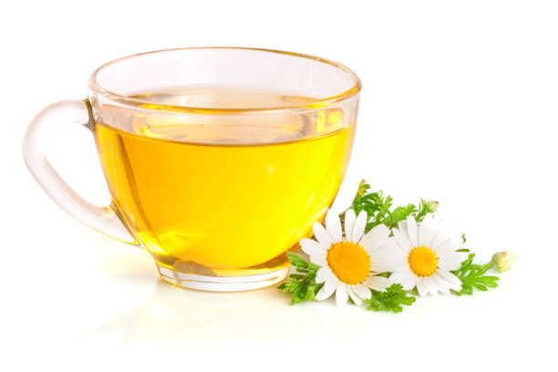 istock Herbal tea with fresh chamomile flowers isolated on white background 842457526