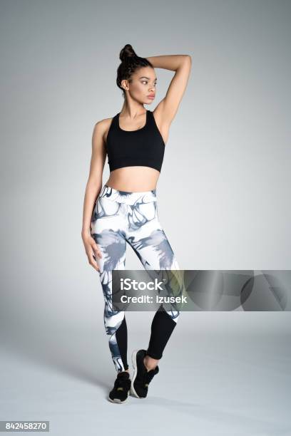 Pretty Afro American Young Woman In Sports Wear Studio Shot Stock Photo - Download Image Now