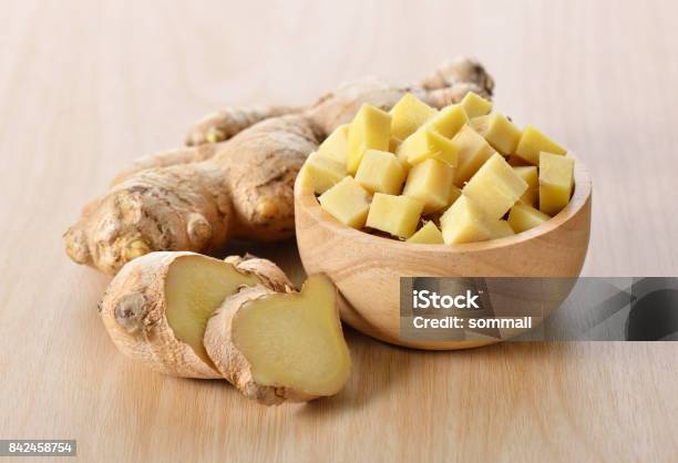 Ginger Sliced In Wood Bowl Stock Photo - Download Image Now - Ginger - Spice, Slice of Food, Close-up