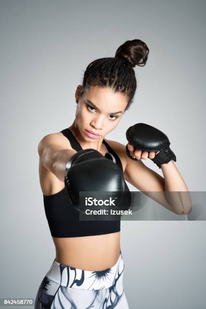 Powerful Young Woman Boxing Studio Shot Stock Photo - Download Image Now - 16-17 Years, Abdomen, Adult